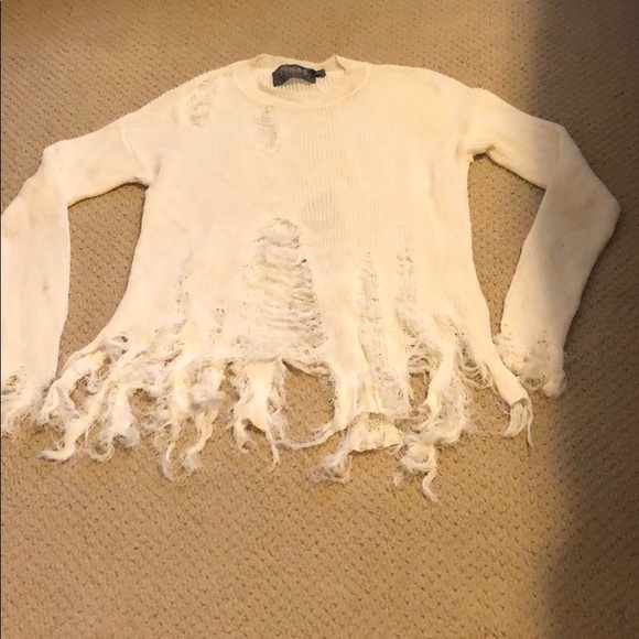 white ripped sweater